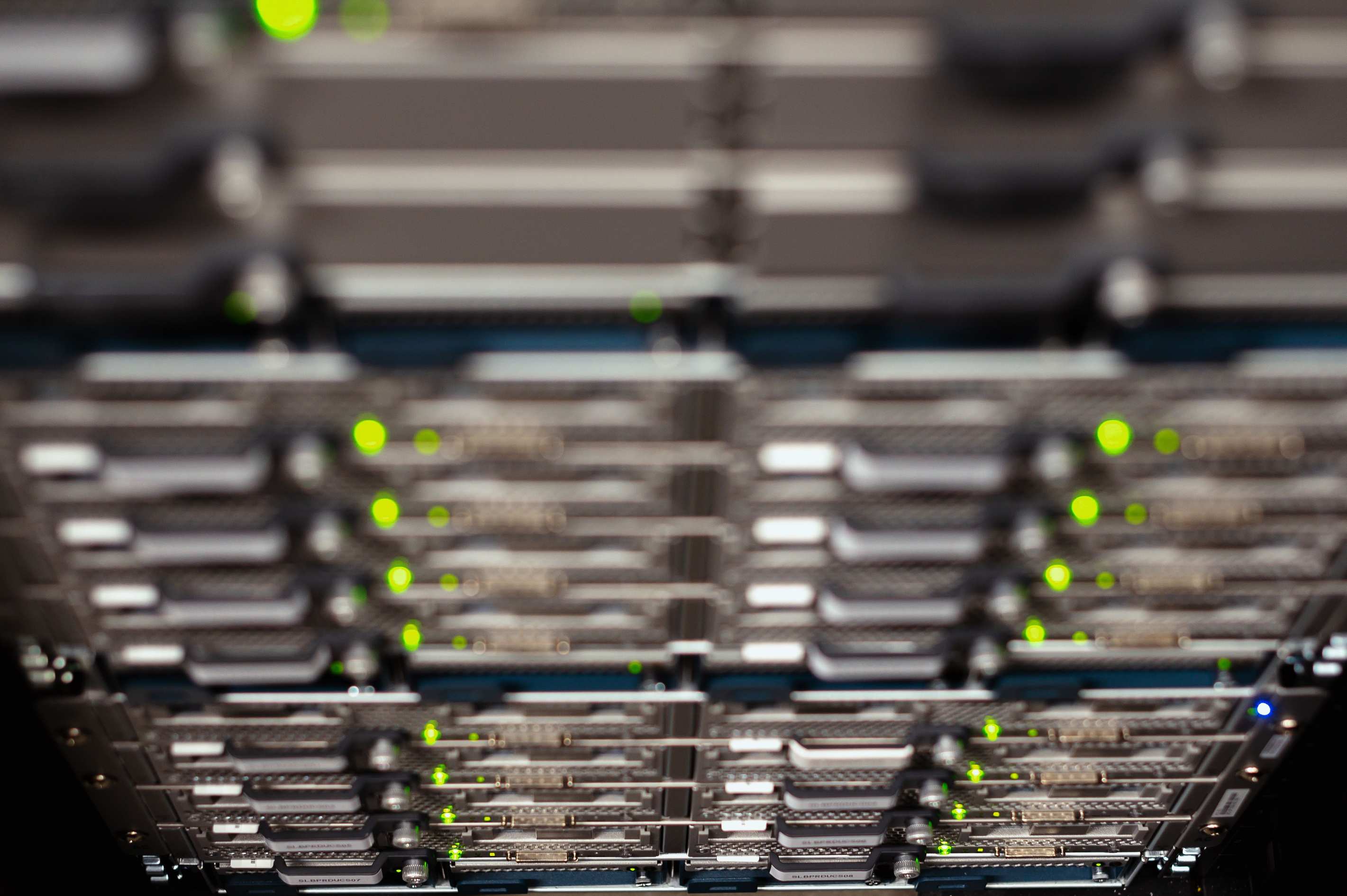 Server racks and network cabling in a data hall in a modern data center